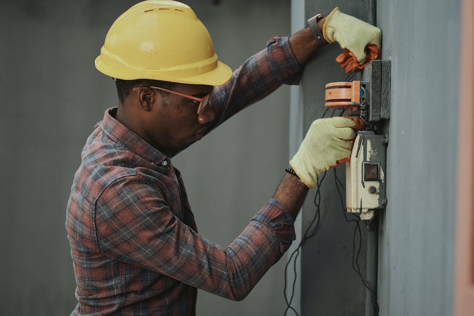 A diverse group of electrical engineers discussing circuit designs and problem-solving techniques